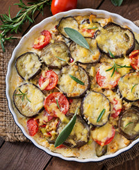 Aubergines met kerstomaten in de oven Cashew cream & paneermeel